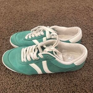white and green suede trainers